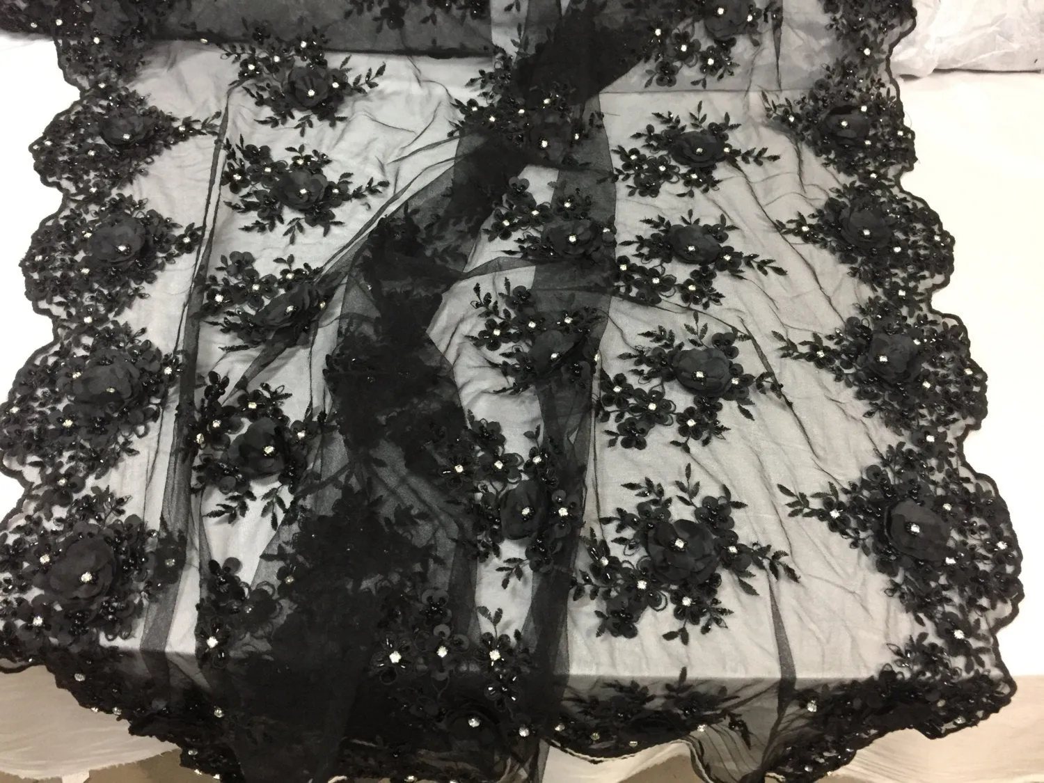 Lavish black 3D flowers embeoider and beaded on a mesh lace -yd